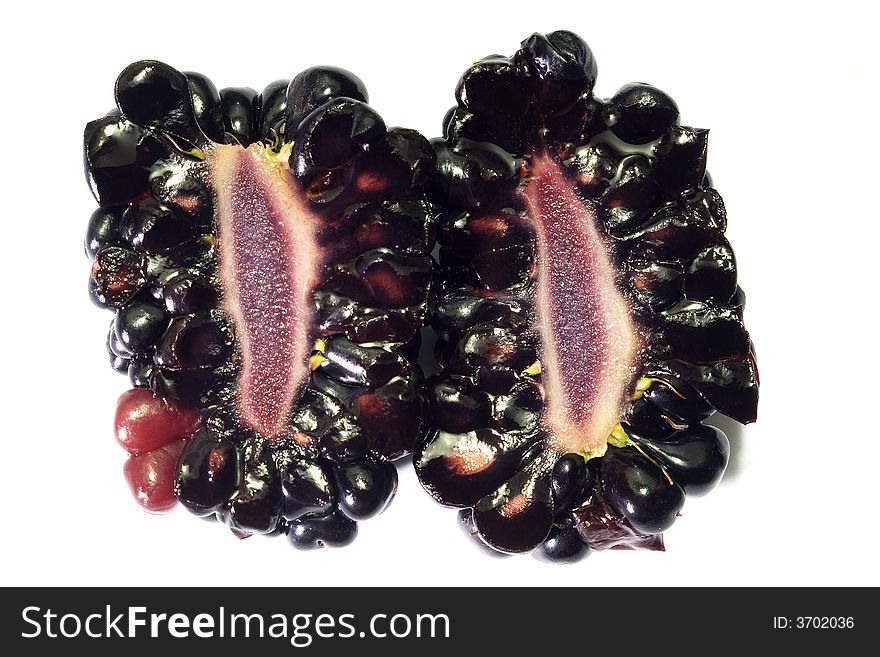 Macro close-up of two half of blackberry isolated with white background