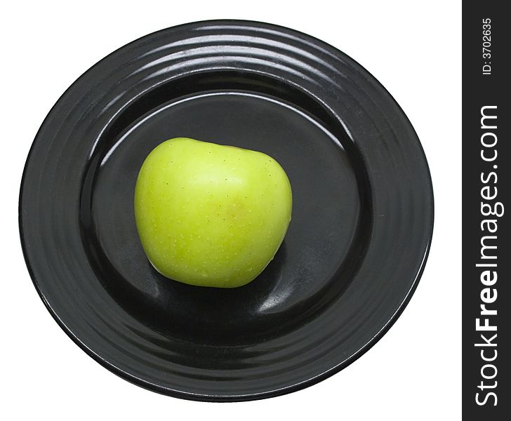 Close-up of fresh apple on a black plate