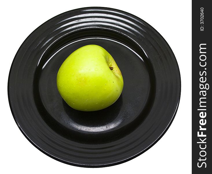 Close-up of fresh apple on a black plate