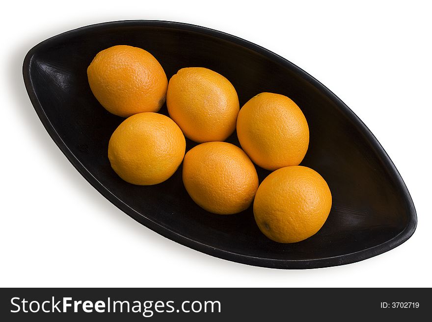 Close-up of black Japanese vase with oranges in white background. Close-up of black Japanese vase with oranges in white background