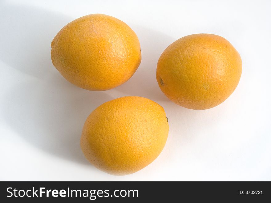 Three oranges with white background