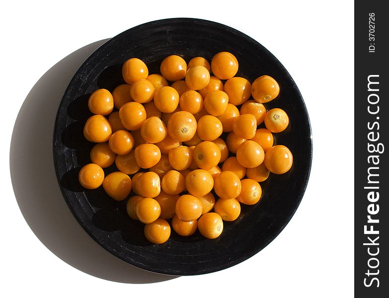 Close-up of black plate with cape gooseberries. Close-up of black plate with cape gooseberries