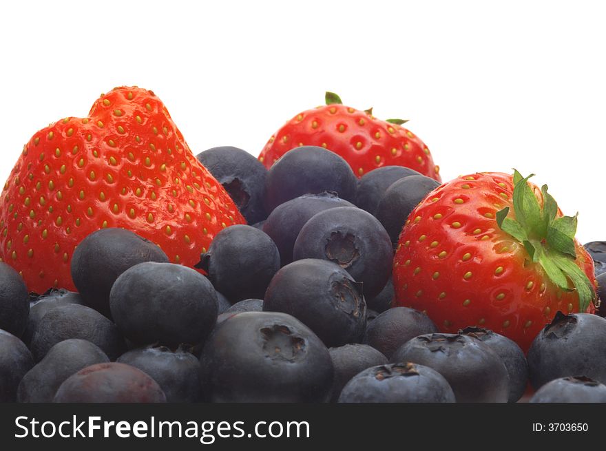 Strawberry and bilberry on white background