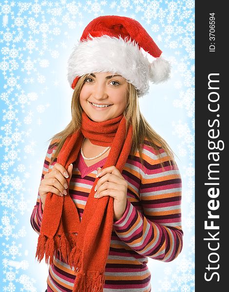 Christmas girl in red hat and scarf and snowflake and starlet