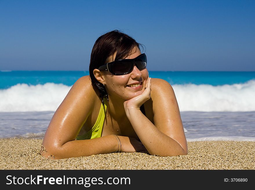 Young woman is relaxing on the beautiful beach. Young woman is relaxing on the beautiful beach.