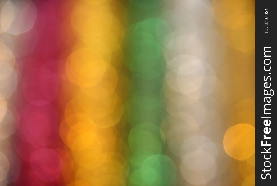 A bright defocused light pattern in rainbow colors. A bright defocused light pattern in rainbow colors