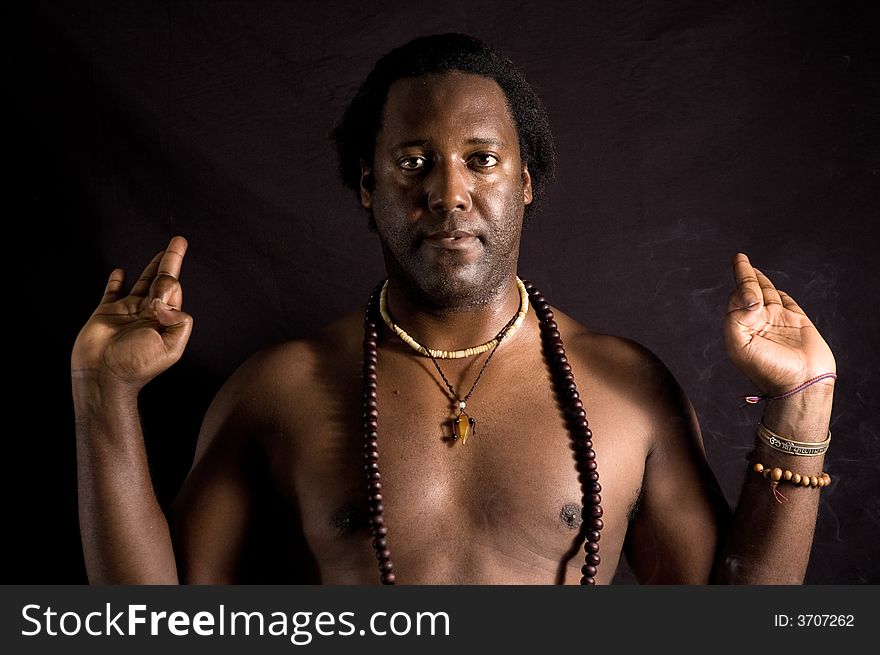 Yogi - Portrait of afroamerican man doing yoga - isolated on black