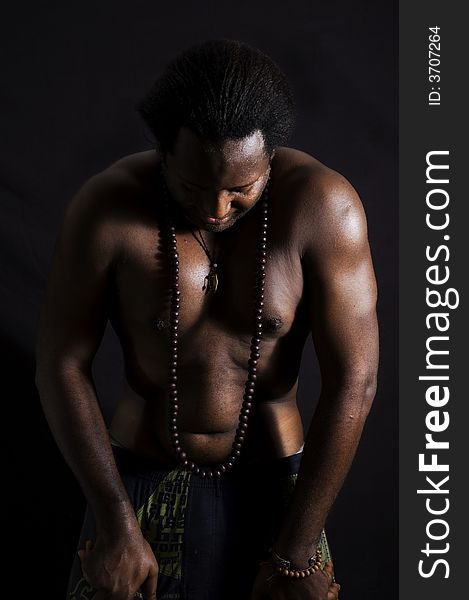 Portrait of afroamerican man doing yoga - isolated on black. Portrait of afroamerican man doing yoga - isolated on black