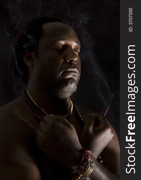 Portrait of afroamerican man in meditation - isolated on black