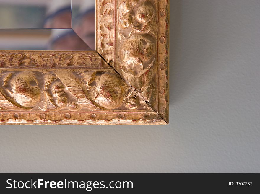 Gilt edged frame of a mirror
