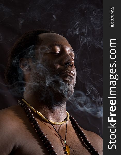 Portrait of afroamerican man in meditation - isolated on black