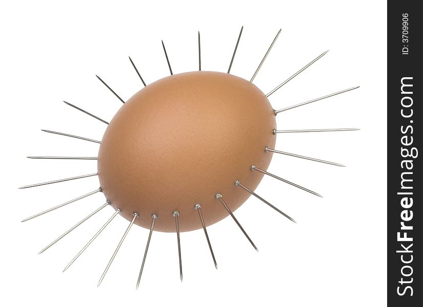 Egg with needle on white background