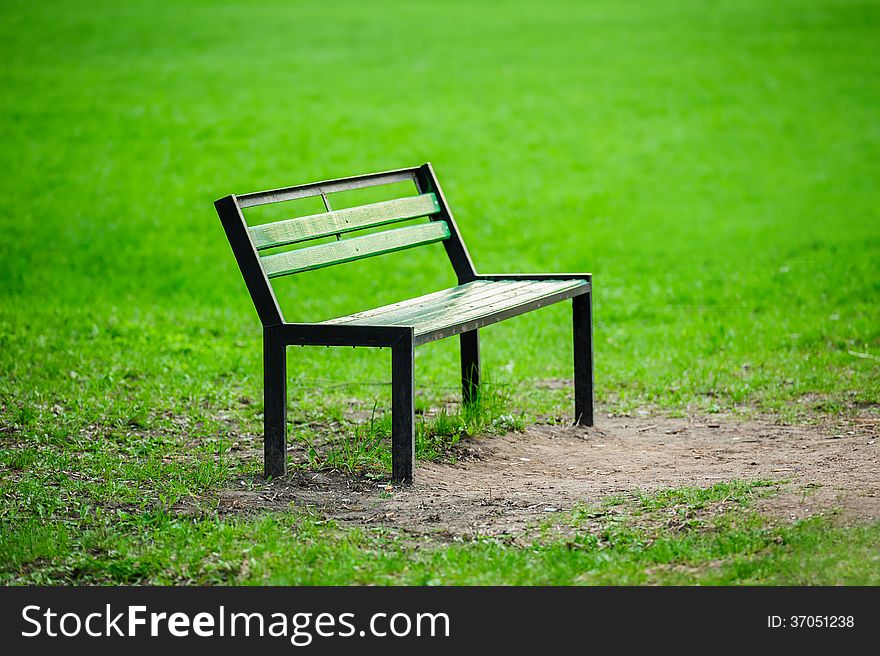 Lonely broken bench in the park