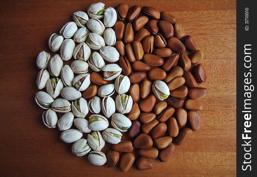 Pistachio and pine nuts; the shape of Black & White Fish