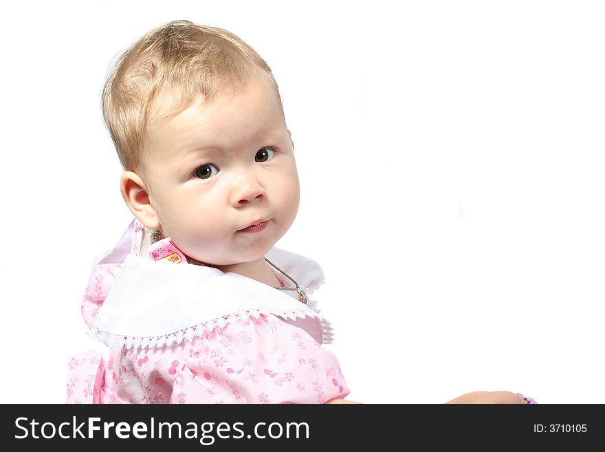 The small child looks in a camera on a white background