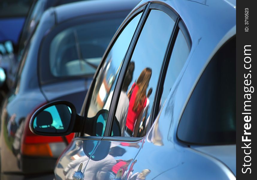 Reflections of people in cars parked by seaside. Reflections of people in cars parked by seaside