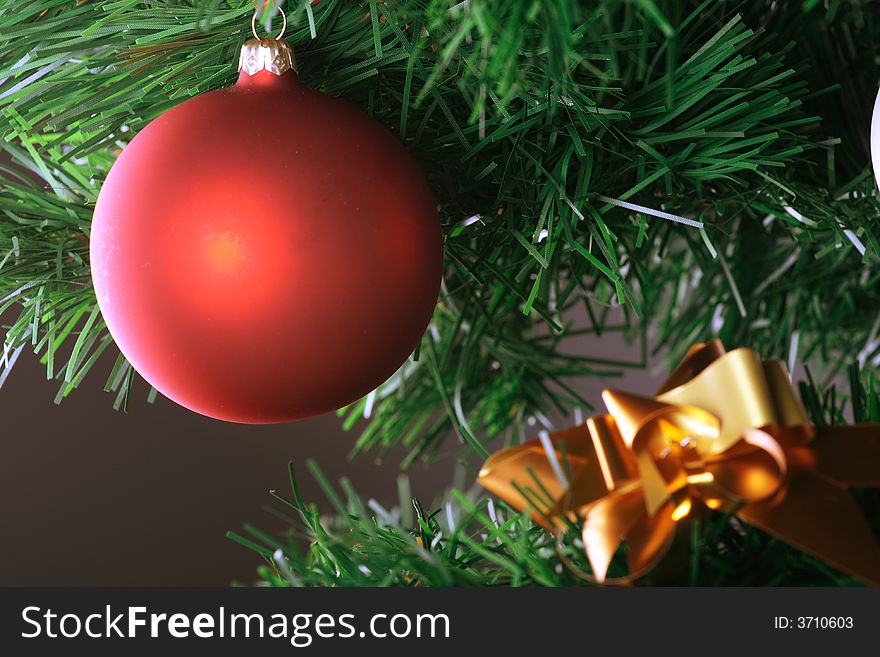 Red Ball Hanging From Christmas Tree