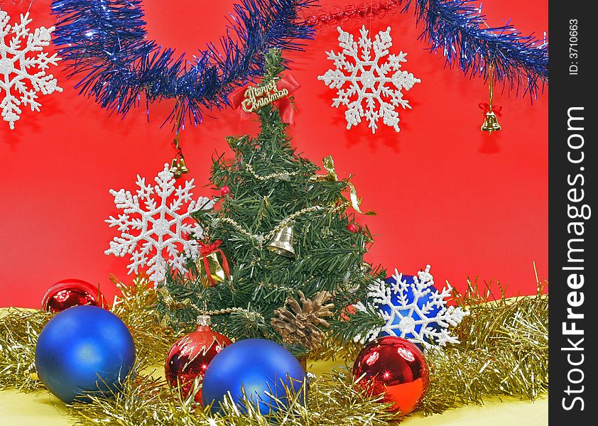 New year's embellishment under artificial fir tree. New year's embellishment under artificial fir tree