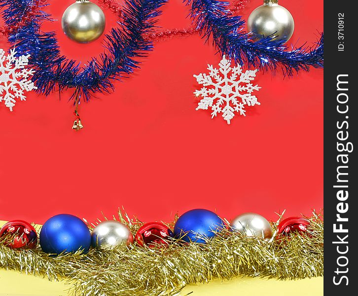 Christmas decoration: varicoloured balls and white snowflakes.
