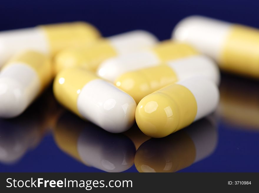 Detail of white, yellow pills
