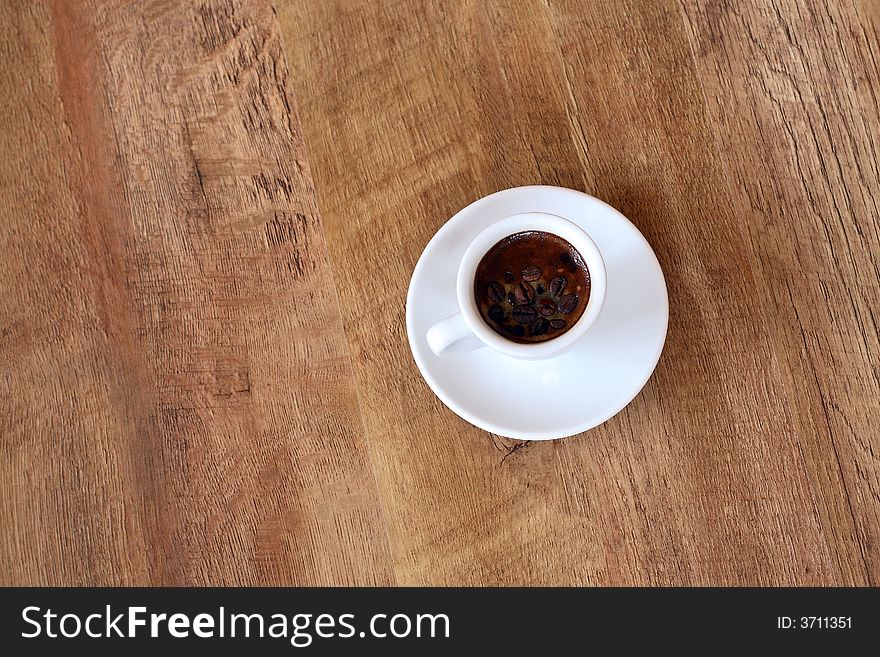 A Cup On Wood