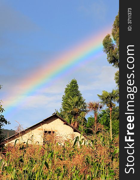 Rainbow over a small hani village