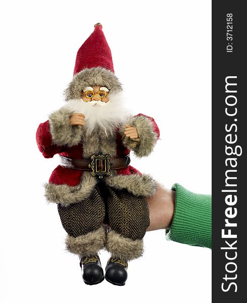 man hand holding toy santa clause. man hand holding toy santa clause