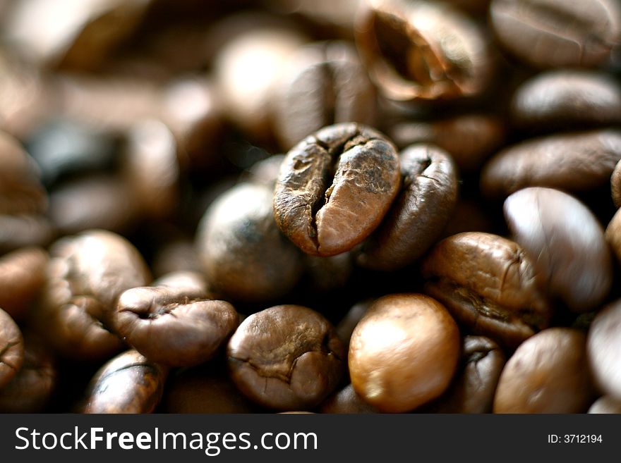 Some brown coffee beans closeup