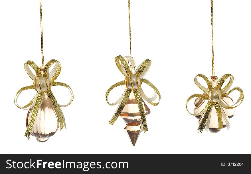 3 glass Christmas decorations over white background