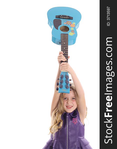 Photo of a rockstar child smashing her guitar straight