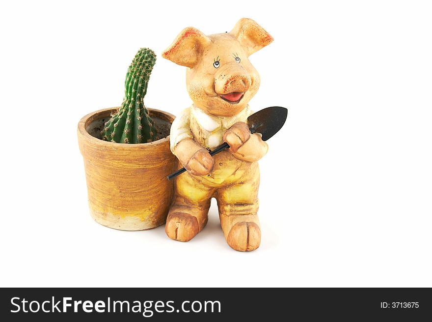 A flowerpot - a pig with a shovel on a white background