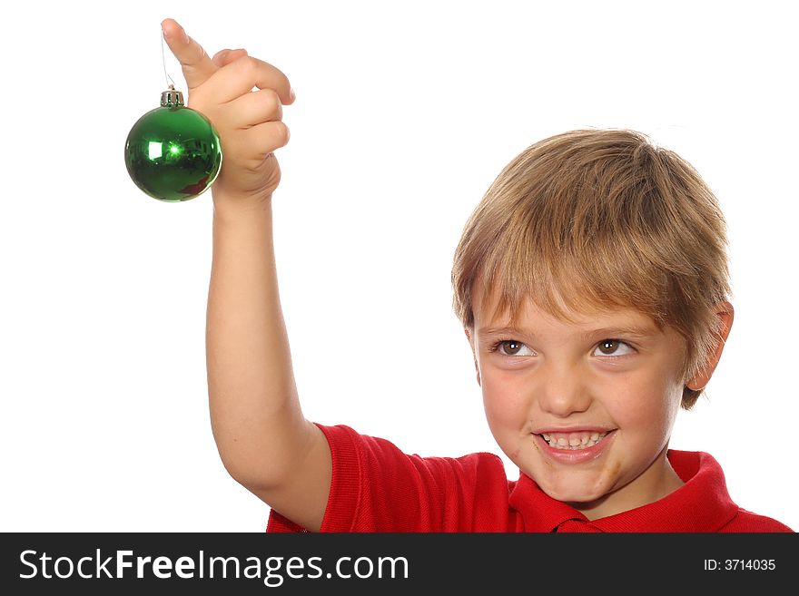 Cute child holding christmas ornament