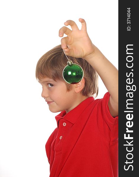 Child holding ornament focus on ball
