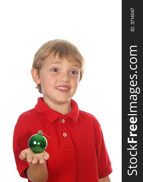 Child holding ornament vertical