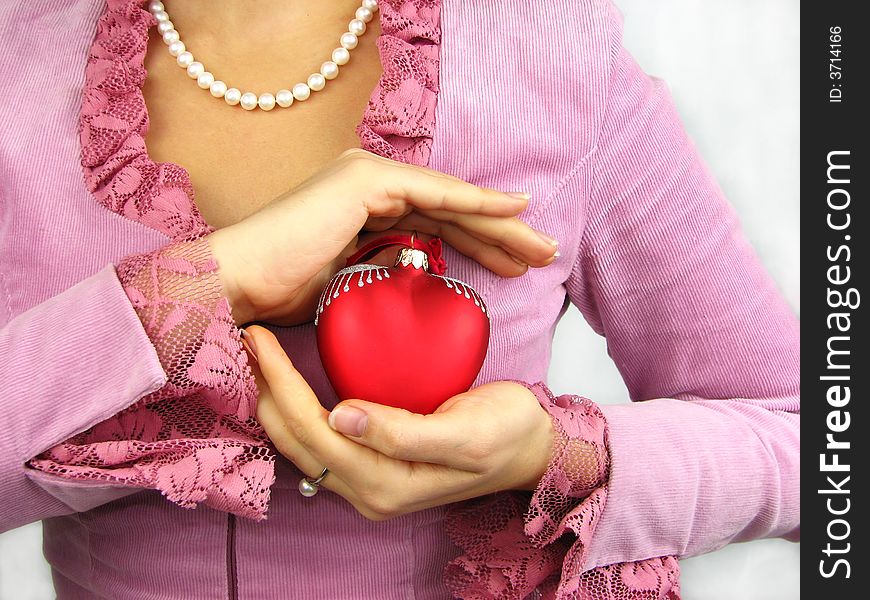 Woman and red heart in hand. Woman and red heart in hand