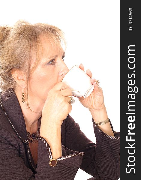 Shot of a woman sipping tea fine china