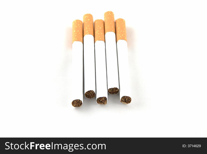 Cigarettes laying on a white background