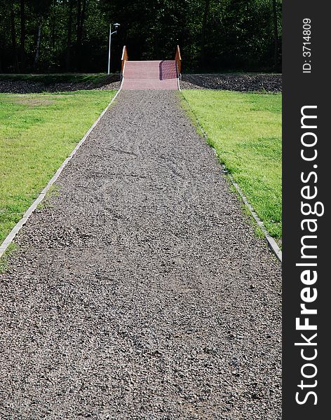 Road, green grass and bridge