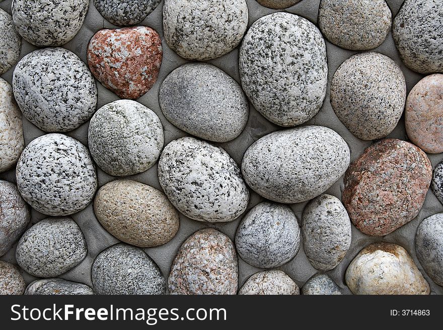 Close up of grey round pebbles