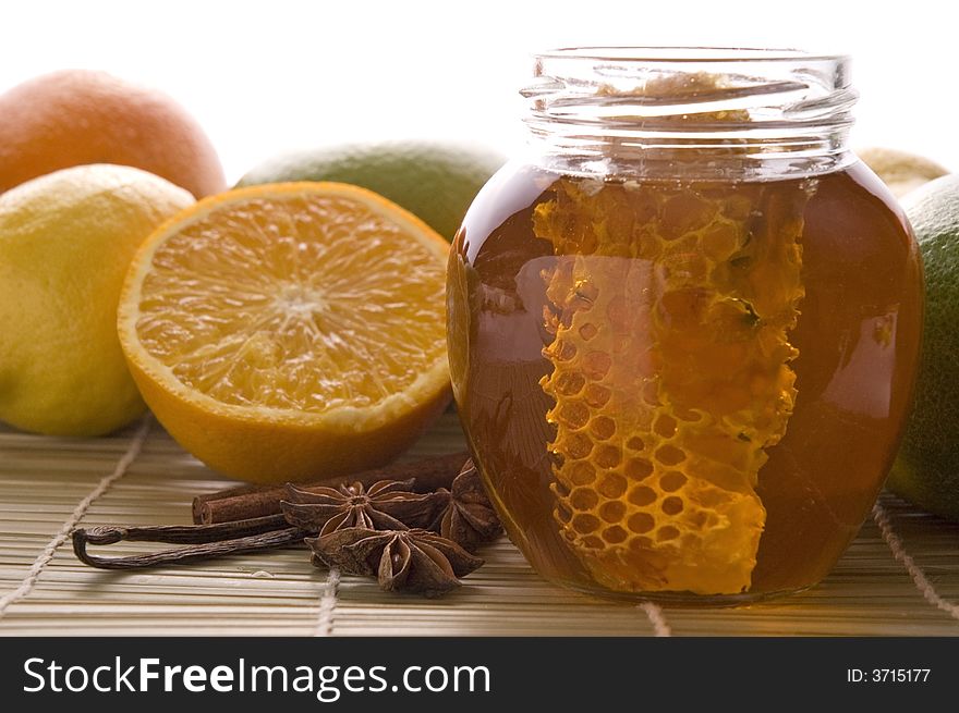 Fresh honey with honeycomb, lemons, oranges, cinnamon, vanilla, anise star. Fresh honey with honeycomb, lemons, oranges, cinnamon, vanilla, anise star