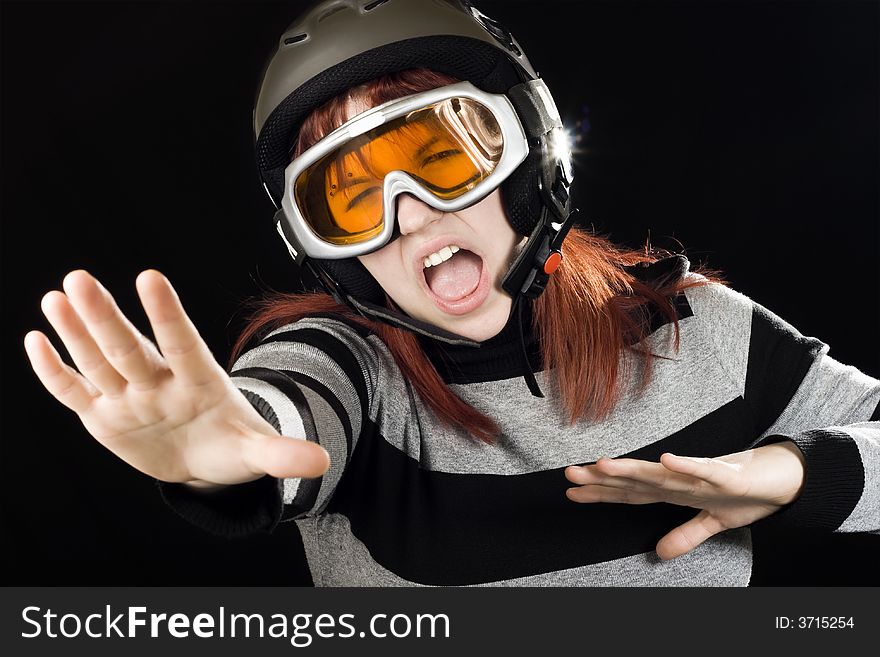 Girl wearing a ski helmet and googles