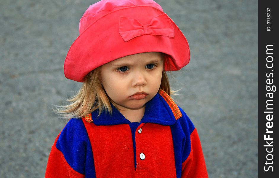 Portrait of the girl in a red hat
