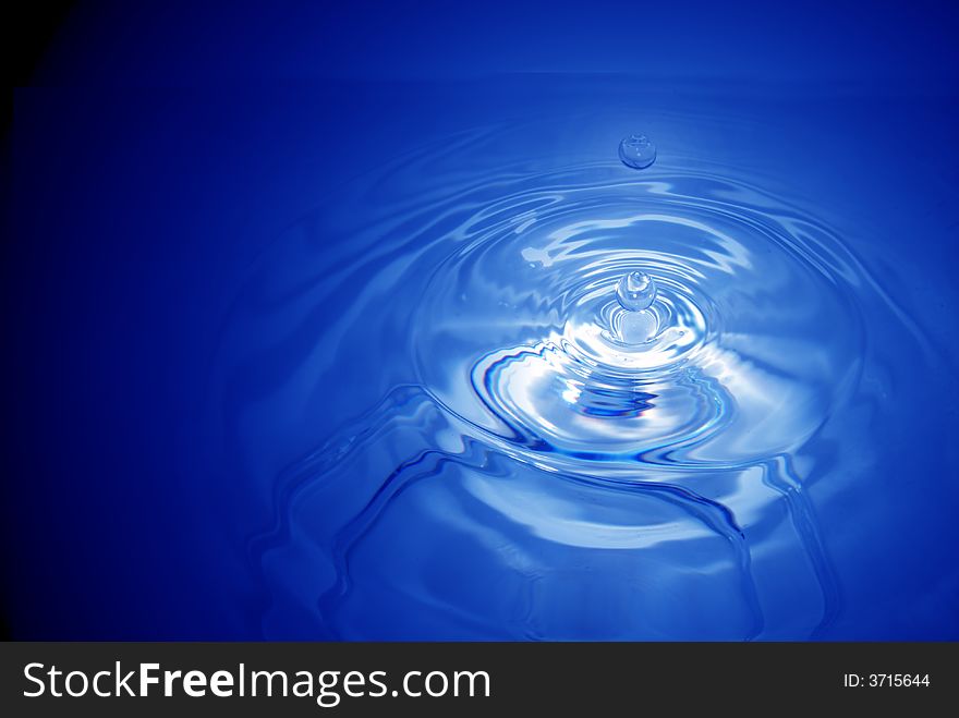 Real water drops in blue. Real water drops in blue