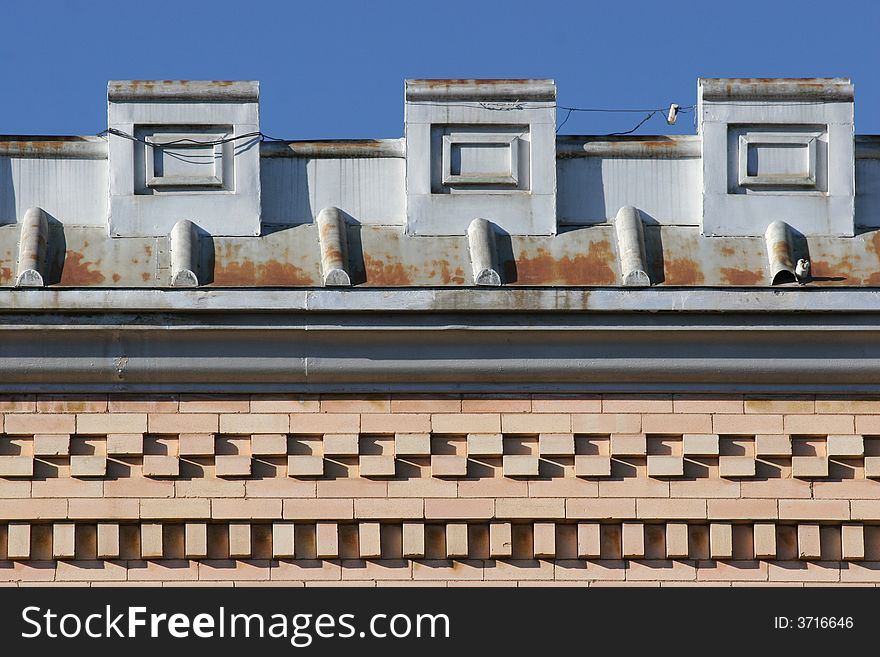 Old building rooftop and brickwork with blue sky background. Old west town. Colorado, USA. Old building rooftop and brickwork with blue sky background. Old west town. Colorado, USA