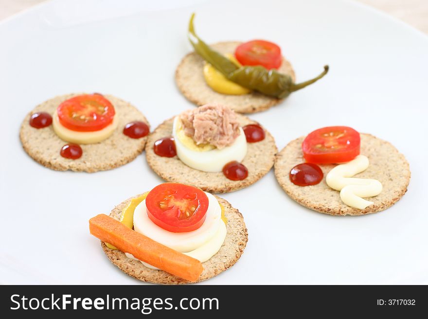 Healthier snacks of oat biscuits, cheese and vegetable slices