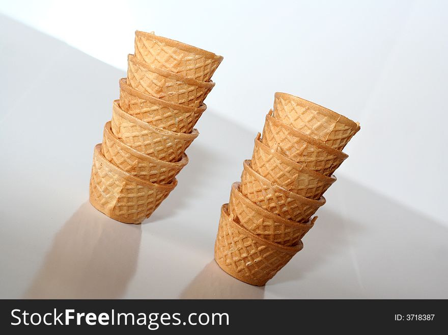 Small glasses of crispy wafer for drinking alcohol / Two small columns