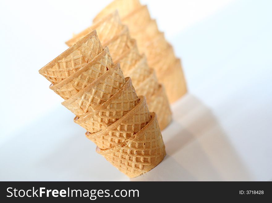 Small glasses of crispy wafer for drinking alcohol / Three small columns opacity gradient