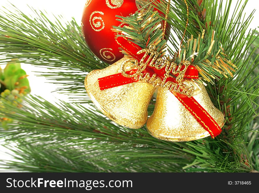 Christmas bells,red ball and fir-tree.