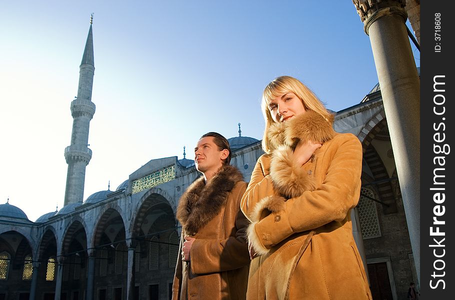 Young attractive couple in lambskin coats (Istanbul, Turkey)