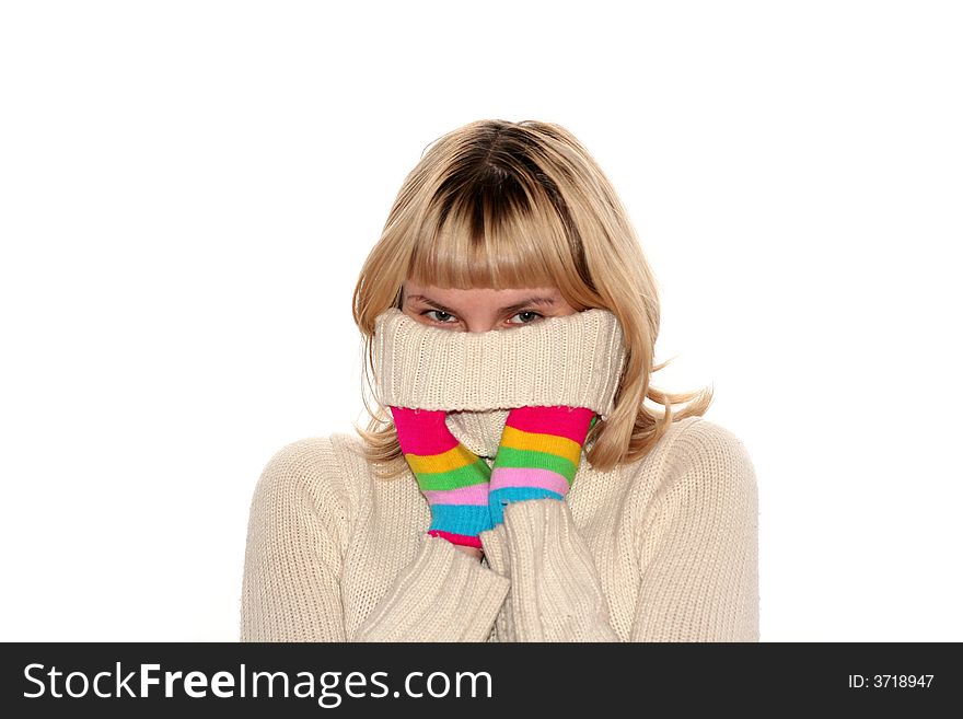 Blond girl in Multi-coloured gloves is trying to hide